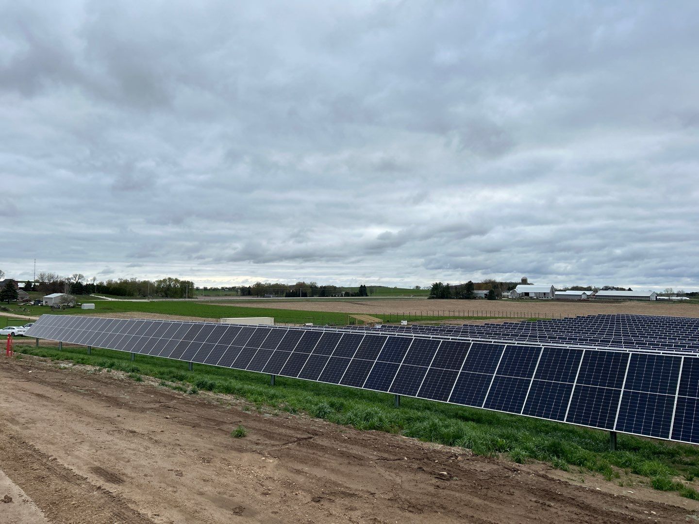 Solar panel field on a cloudy day